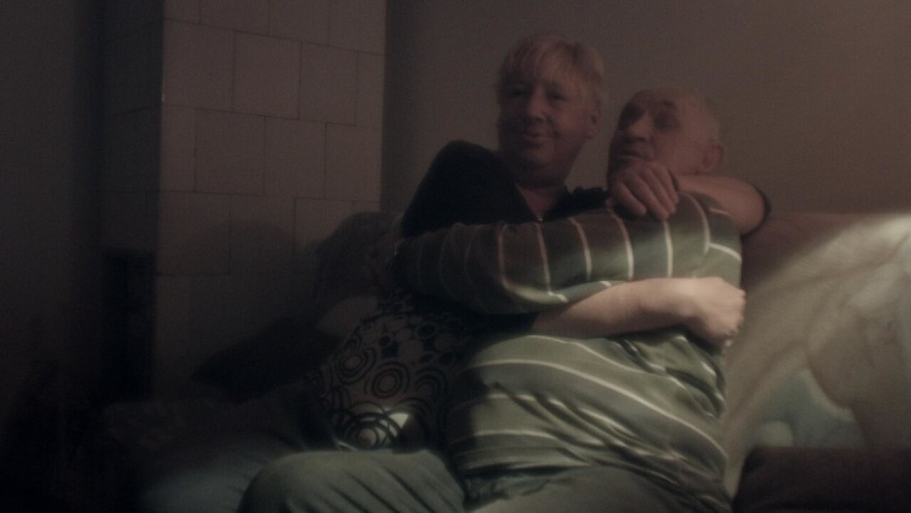 Couple in a room smoking cigarettes