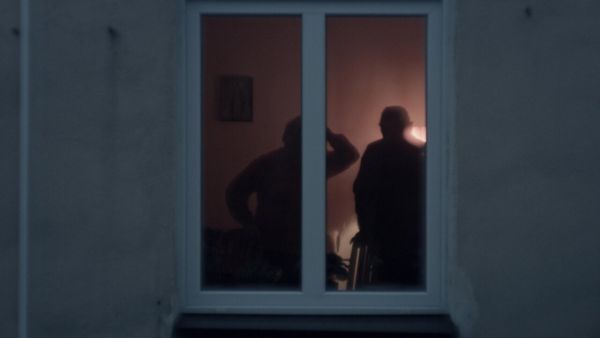 Couple in a room smoking cigarettes
